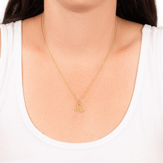 Leo Zodiac Name Necklace. Handcrafted with care, this piece is made from durable stainless steel and optionally dipped in 18k yellow gold and features her unique astrological sign.