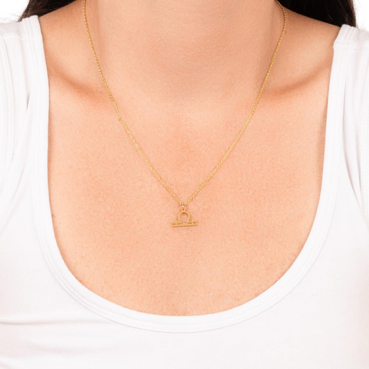 Libra Zodiac Name Necklace. Handcrafted with care, this piece is made from durable stainless steel and optionally dipped in 18k yellow gold and features her unique astrological sign.